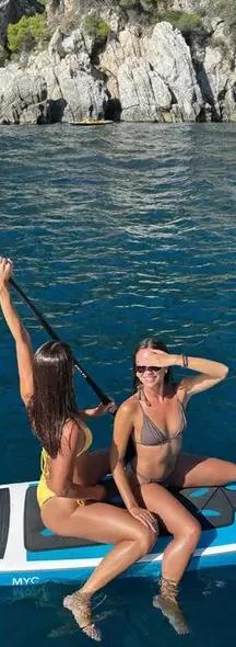 Direction 4: friends on a paddleboard by cliffs