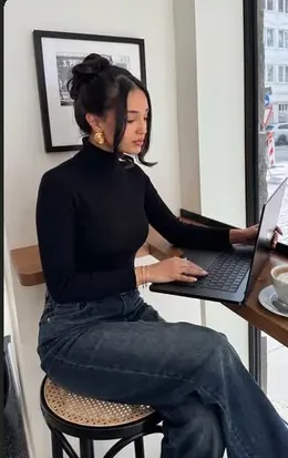 Creator working at a laptop, short video frame